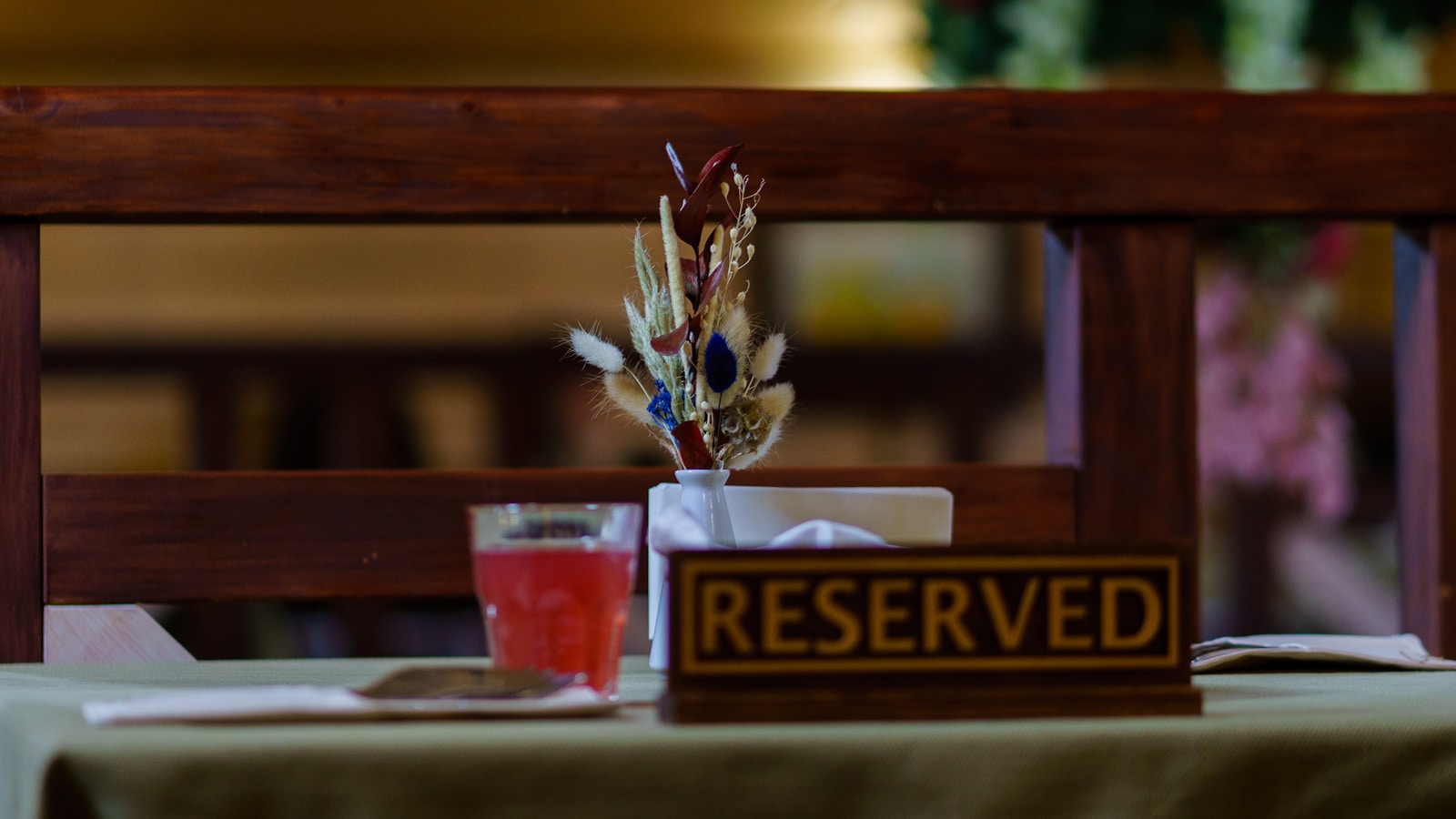 a table with a sign that says reserved