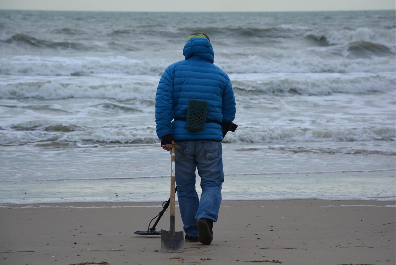 A person Using Metal Detector