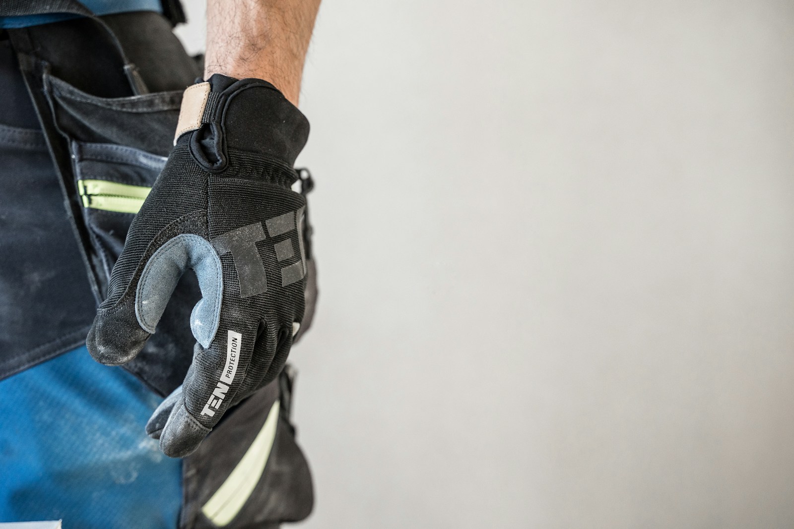 A close up of a person wearing a glove