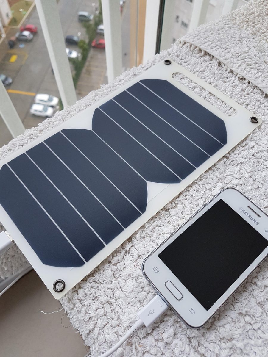 Solar Charger is Charging a Mobile Phone