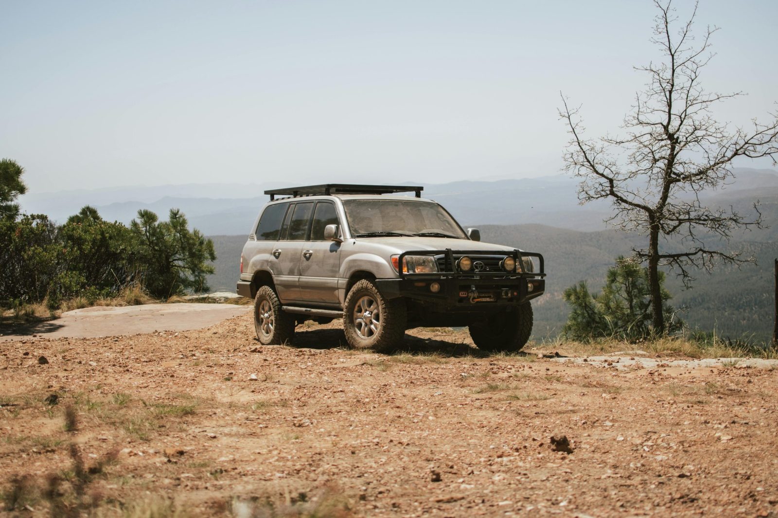 Sturdy off-road SUV parked on a dirt trail.