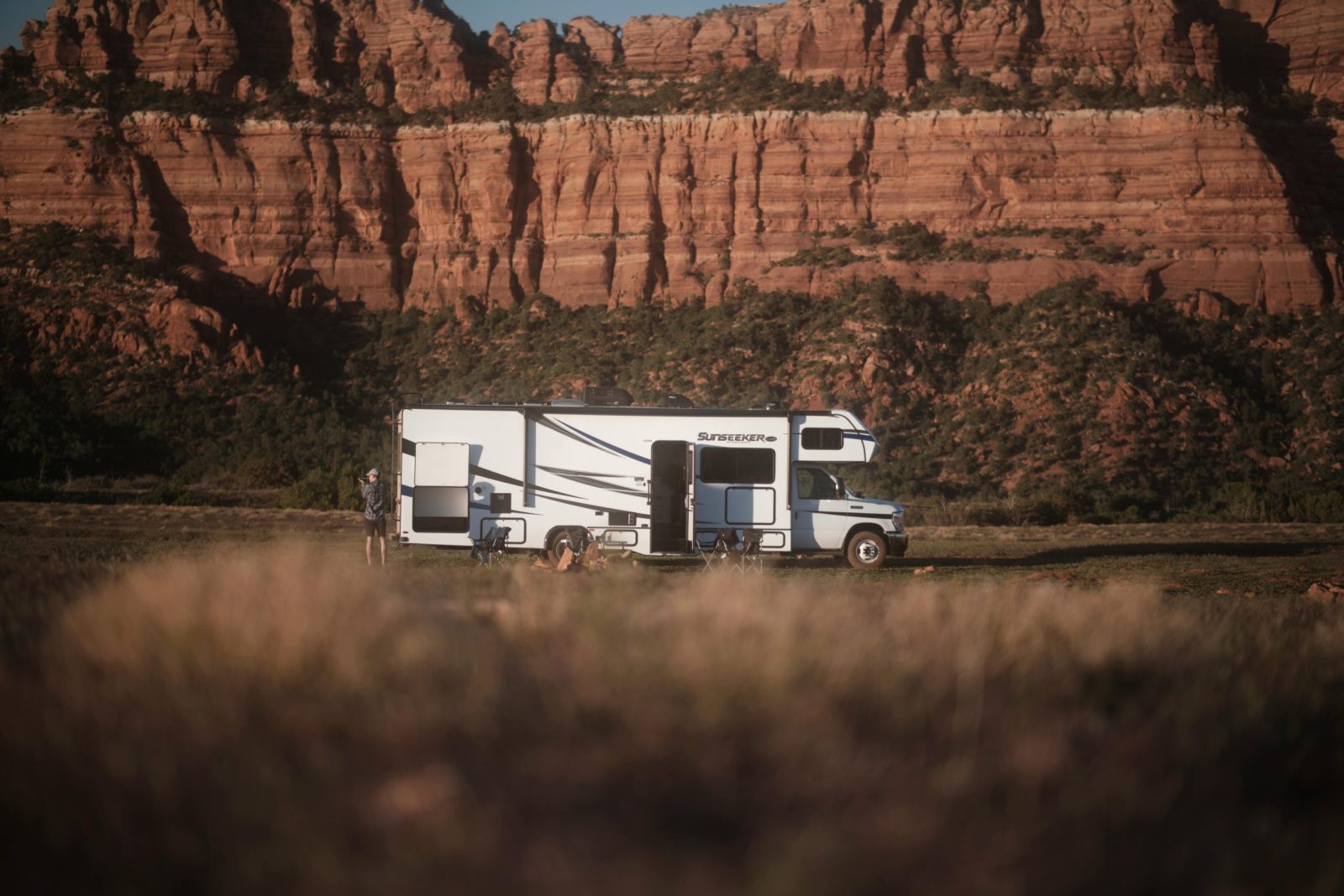 RV Parked Near Utah Canyon Under Clear Sky.