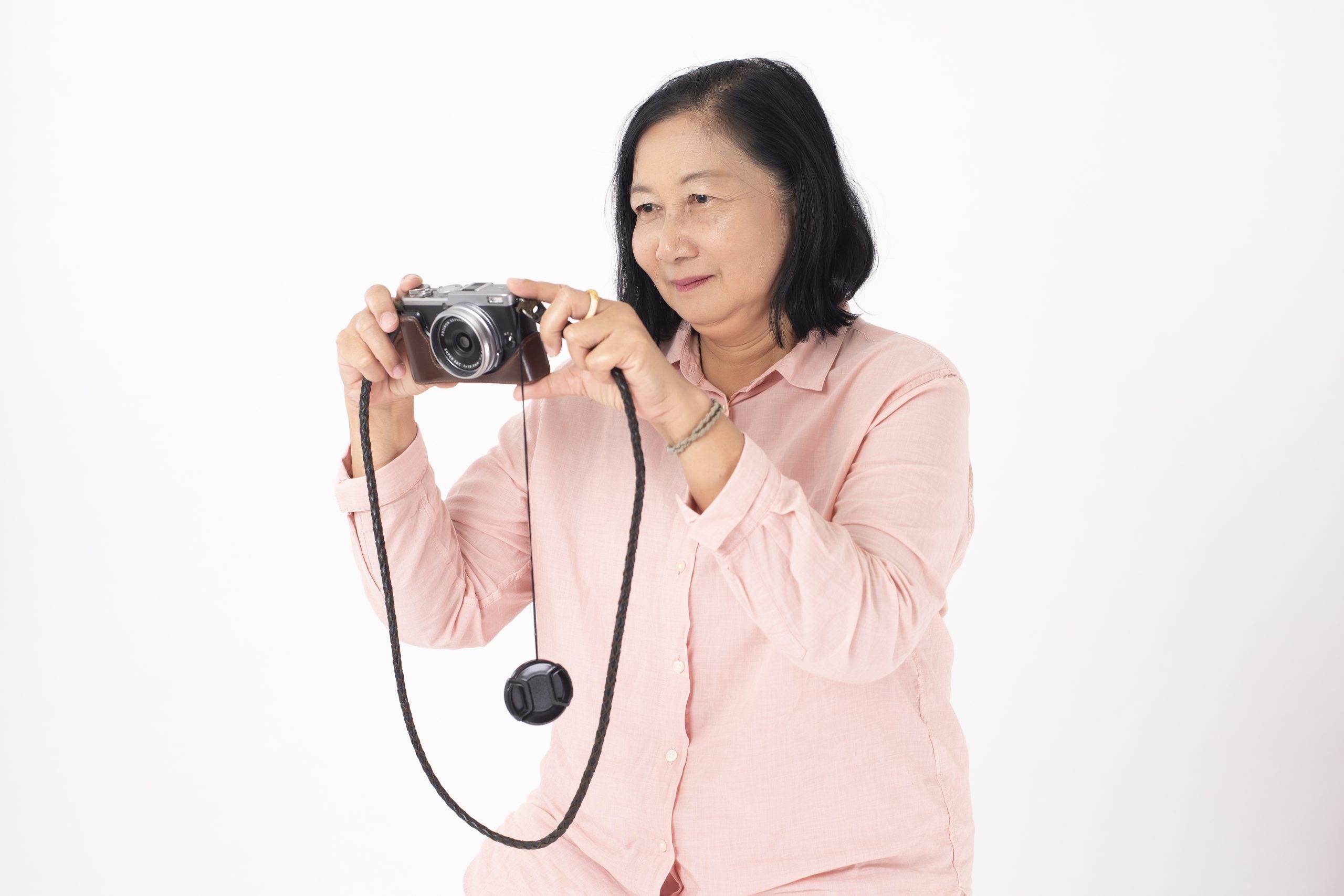 An Old Lady using a Film Camera