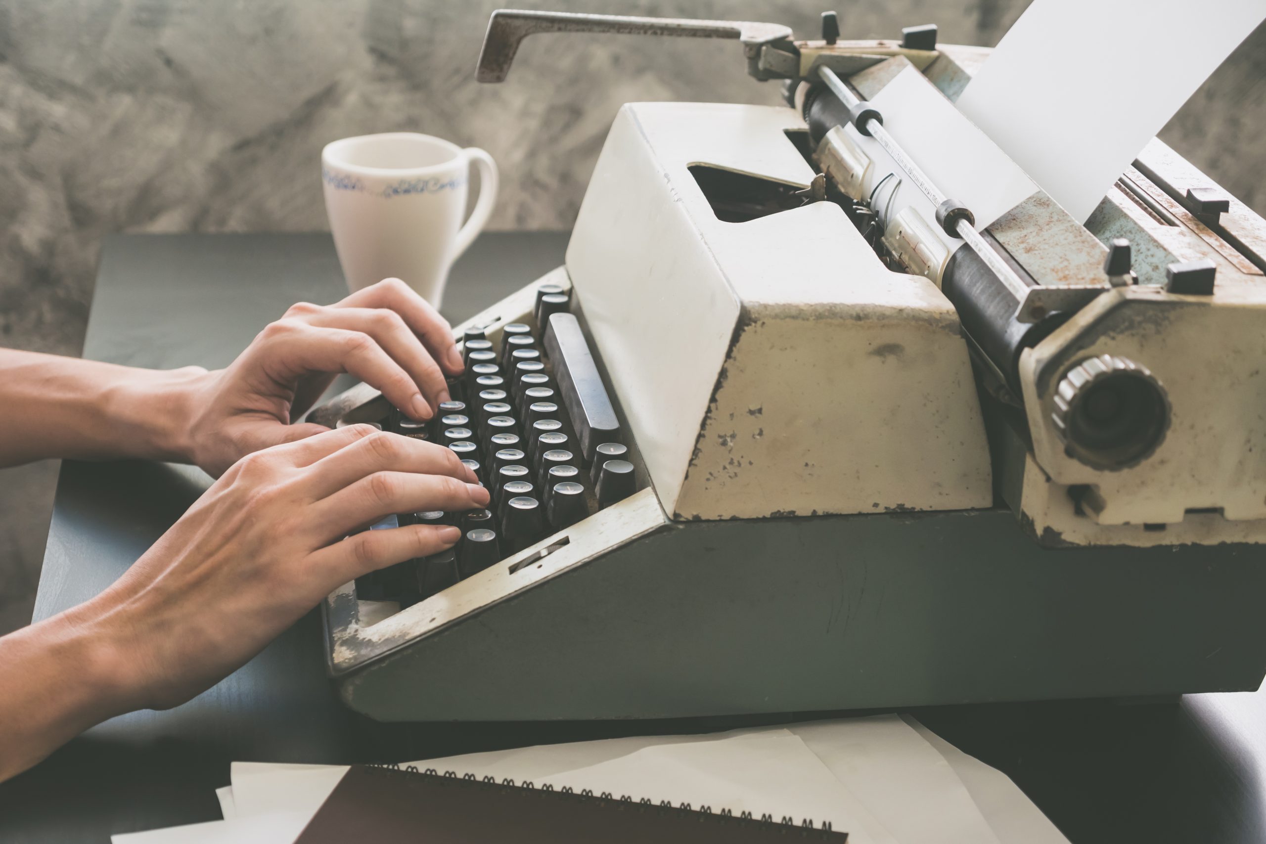 A Person Typing on Typrwriter