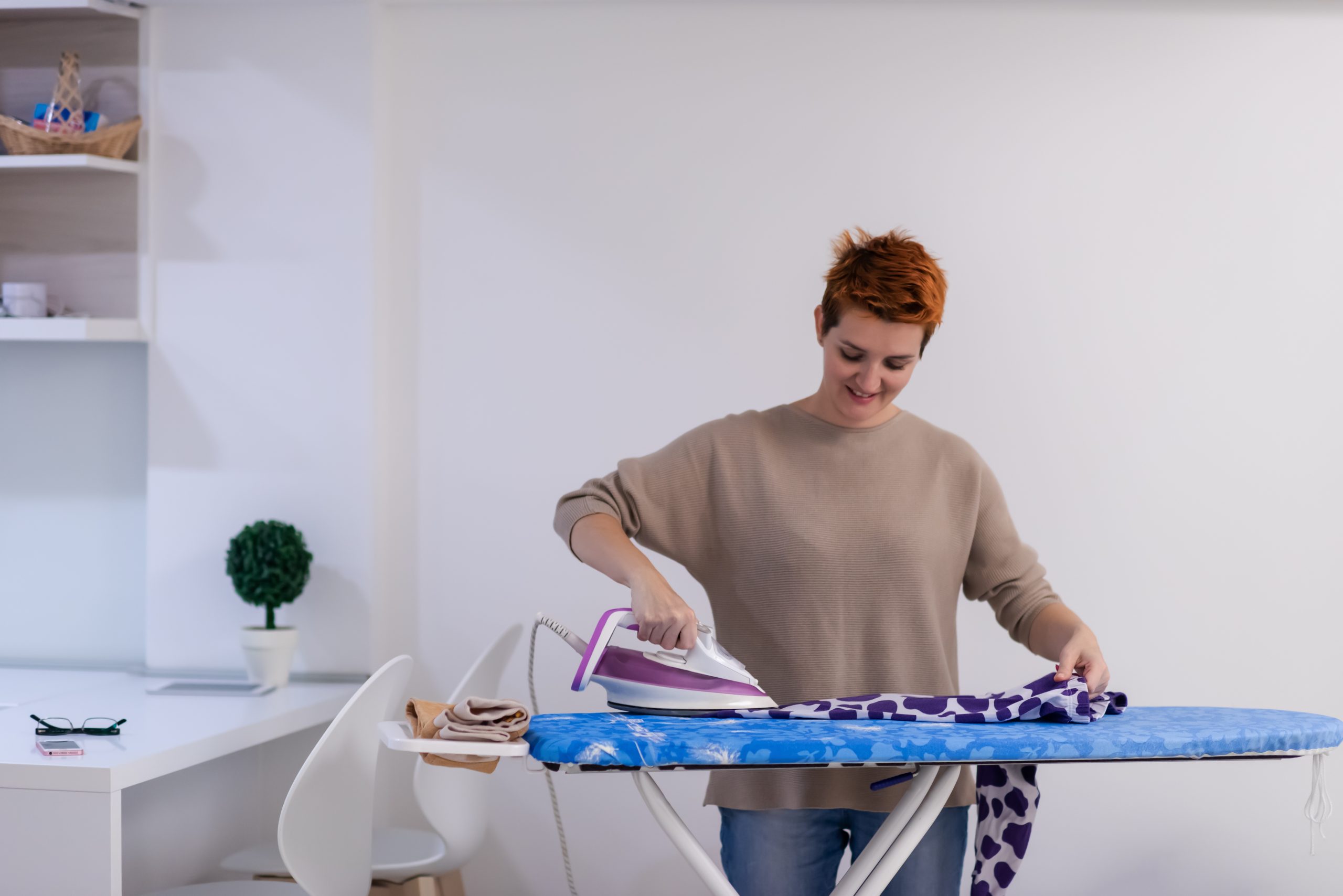 A person Ironing Cloths