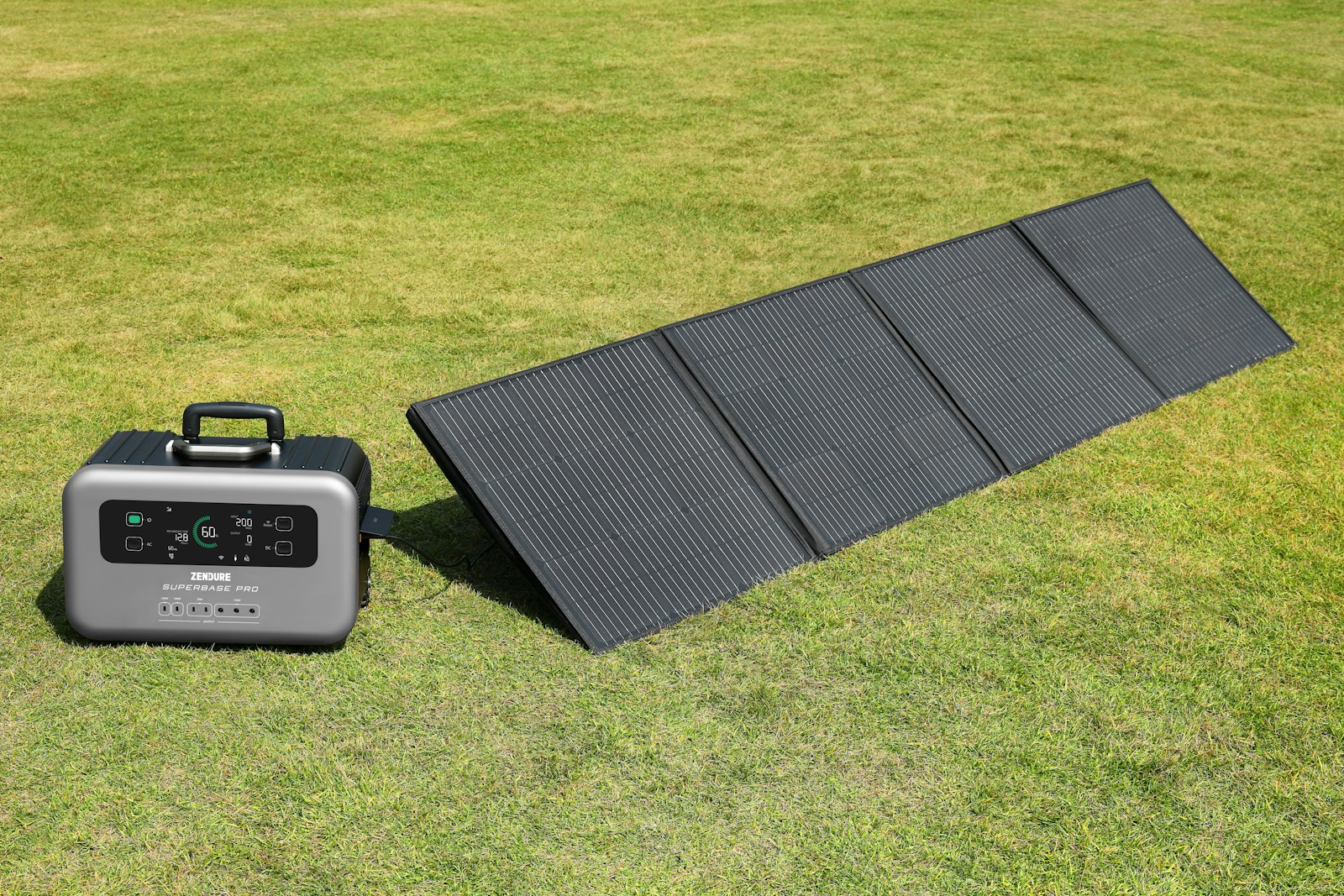 A solar panel and a portable charger on the grass