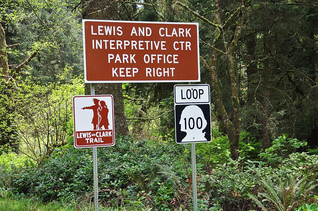 Officials Guiding Hikers with Sign Board