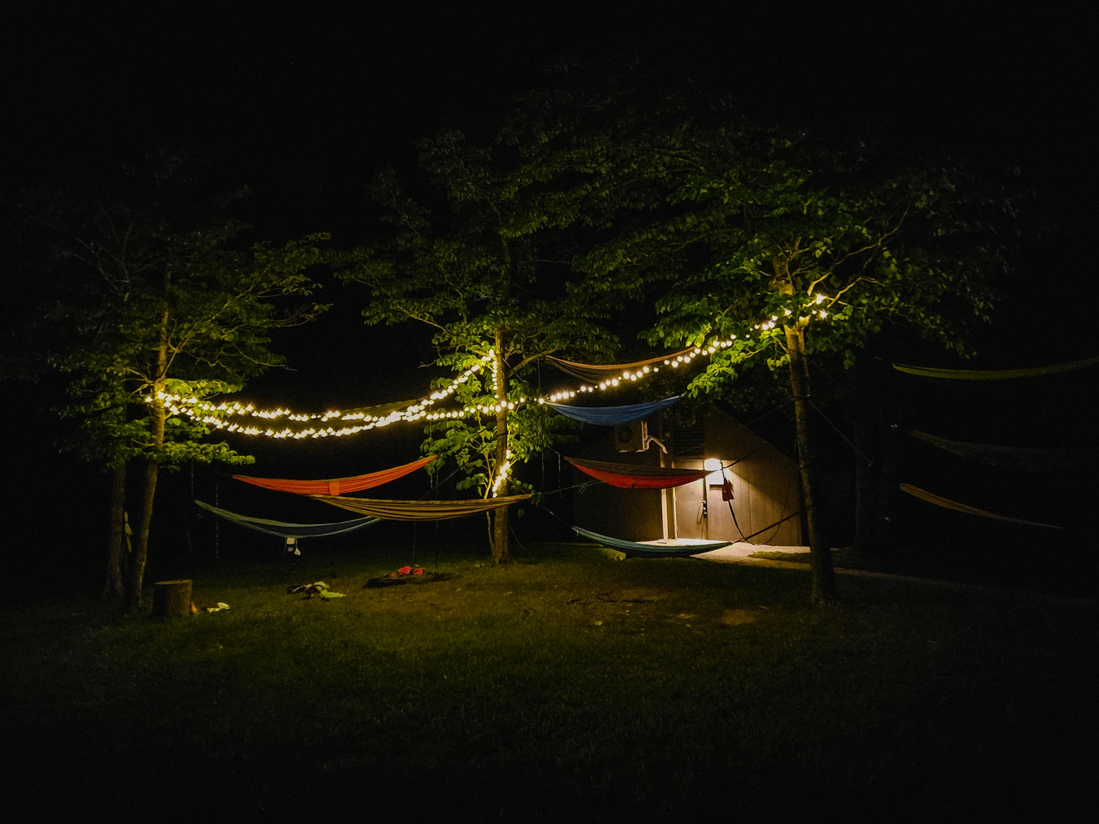 a couple of hammocks sitting in the dark