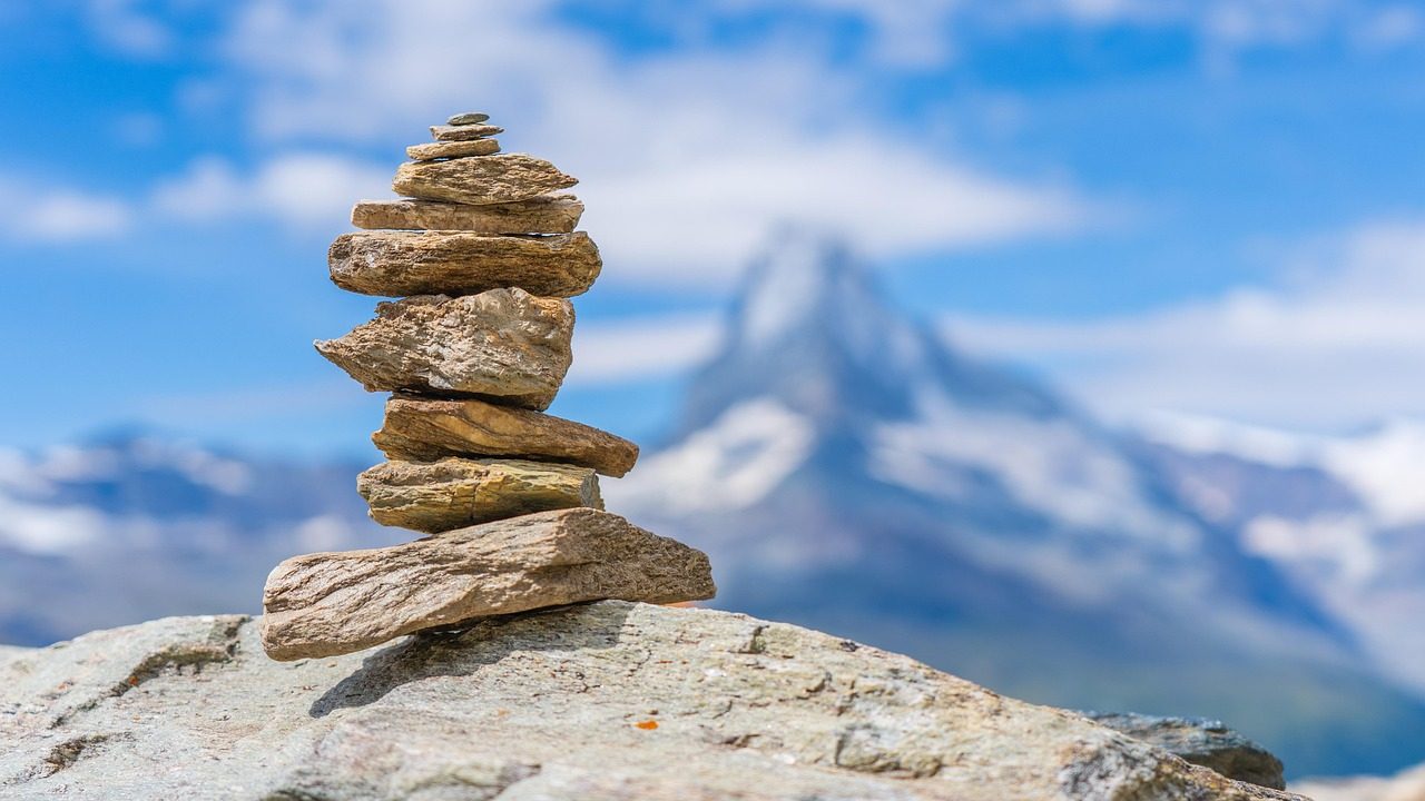 Kids Playing Rock Tower Challenge in Campground