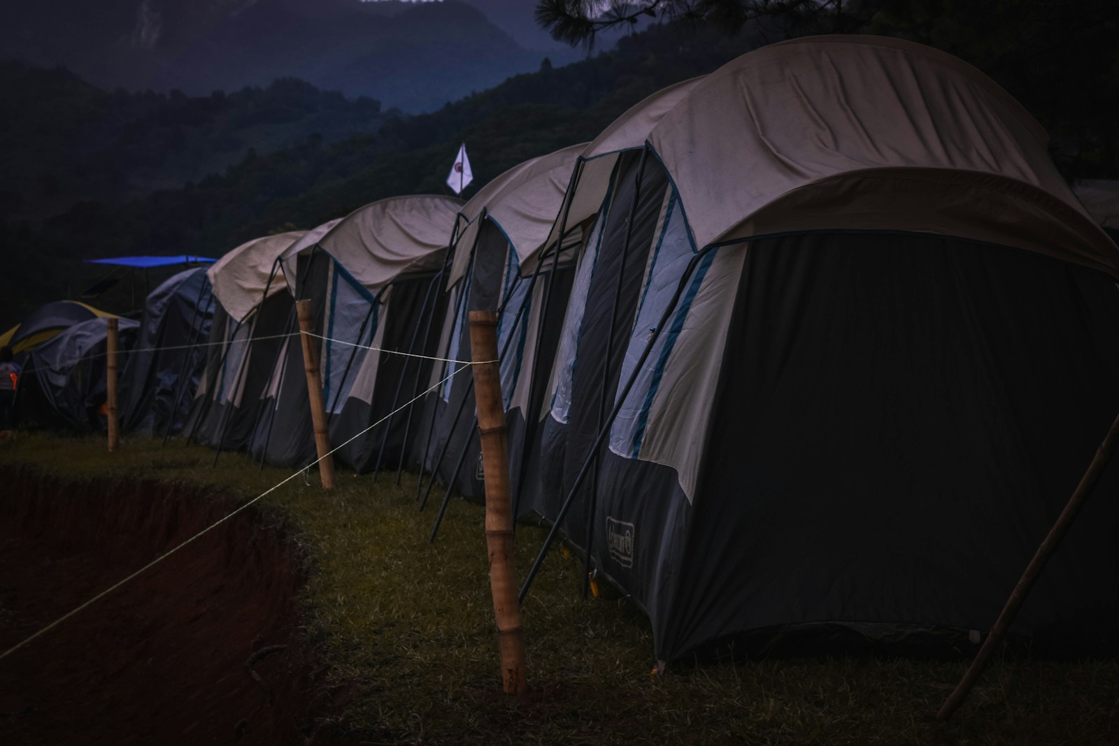 Black and Grey Tents on Green Grass Field
