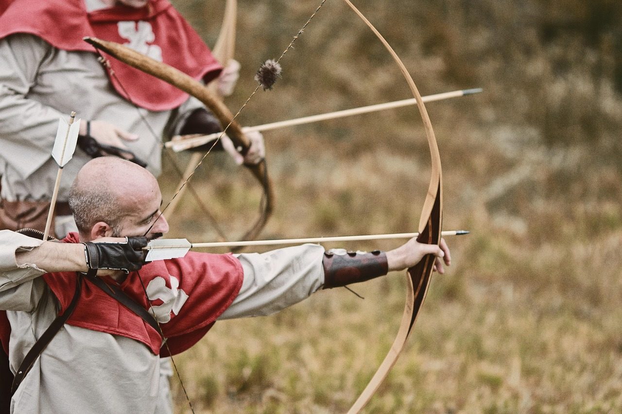 A Person Using Bow and Arrow for Hunting