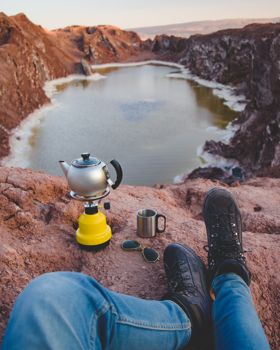 taiki-ishikawa-w6EMxsk8CDA-unsplash Person Wearing Camping Boots Looking at Lake