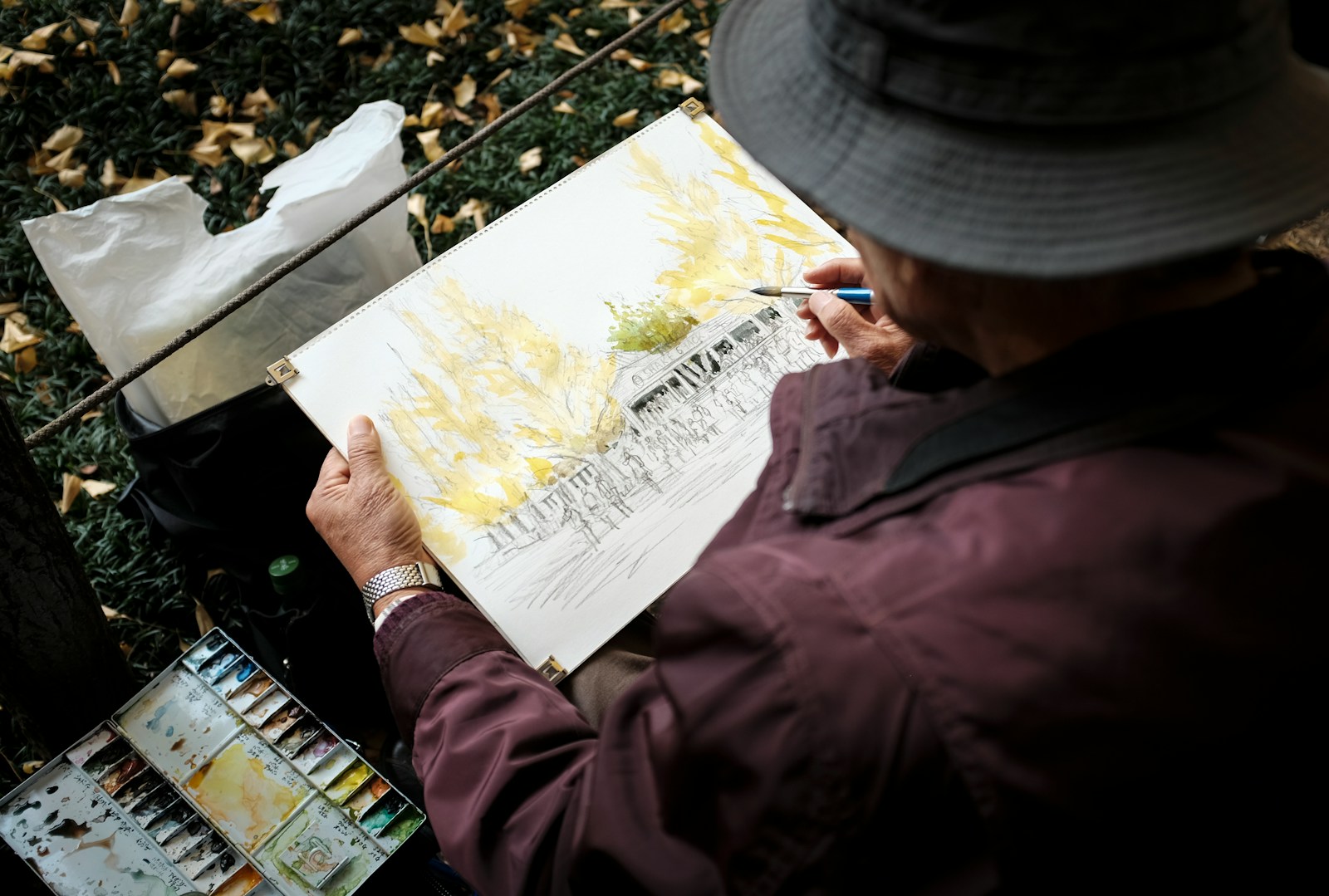 A Person Sketching on a paint board in Forest