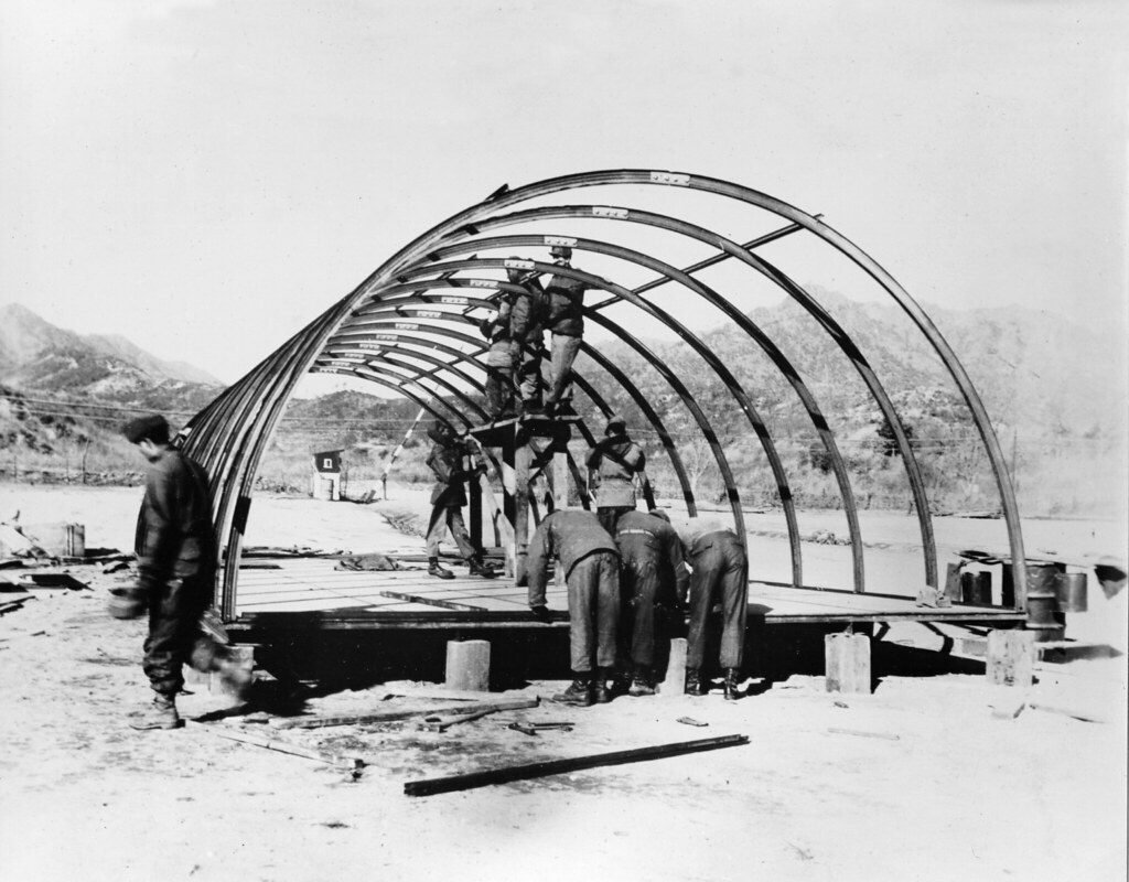 A Group Building a Quonset Hut
