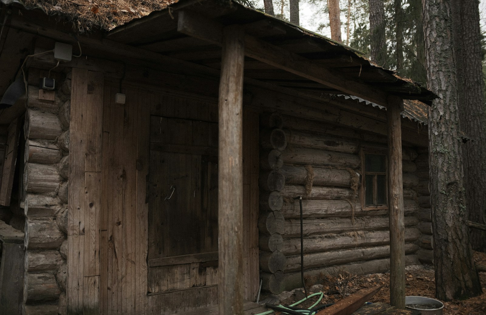 a wooden cabin with a roof