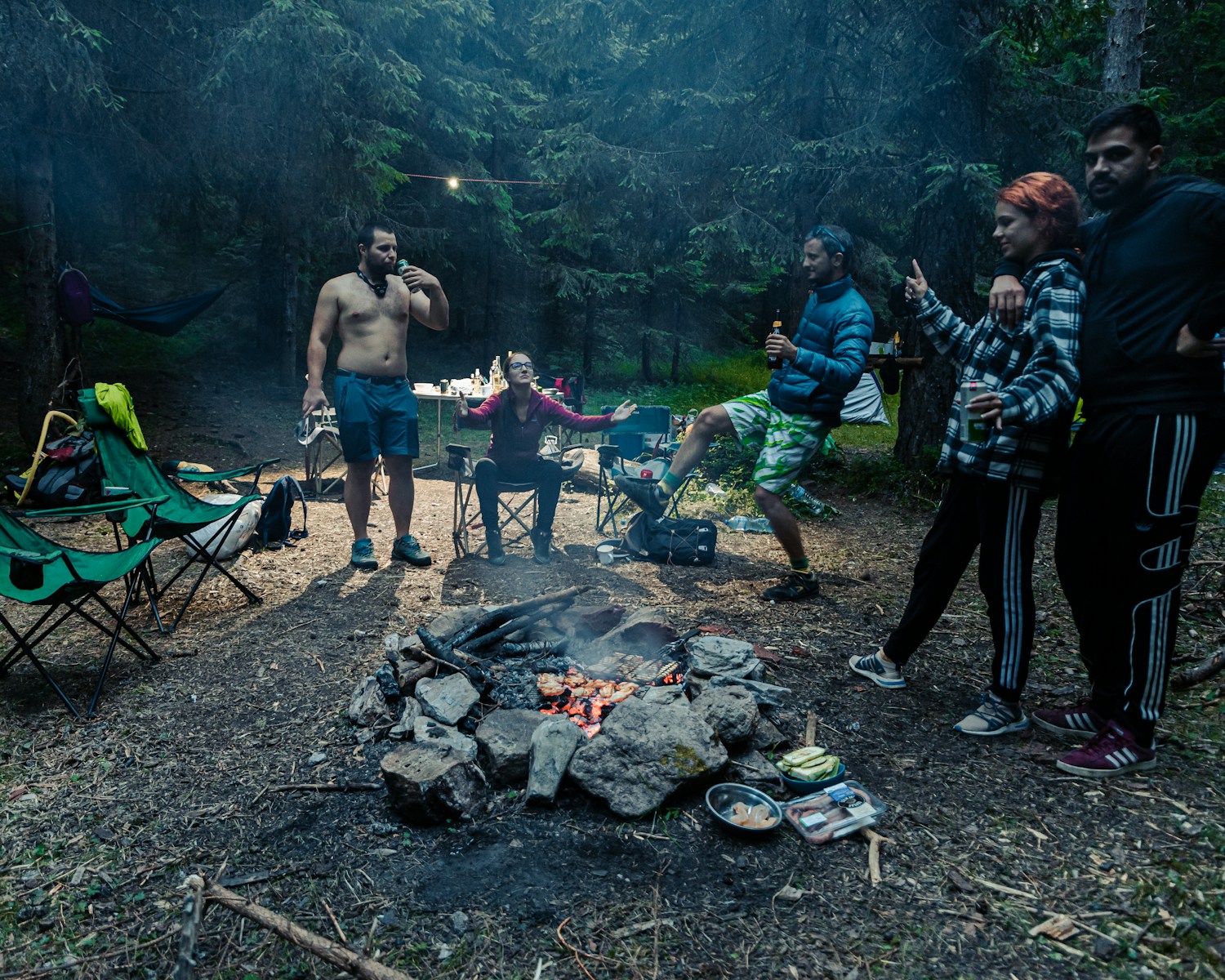 A Group Discussing Survival Myths while camping