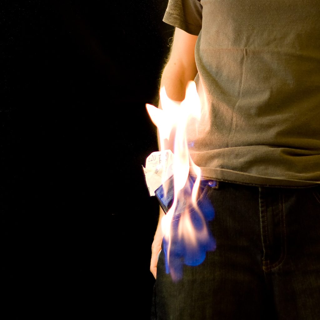A Person Standing While His Cloth Burning