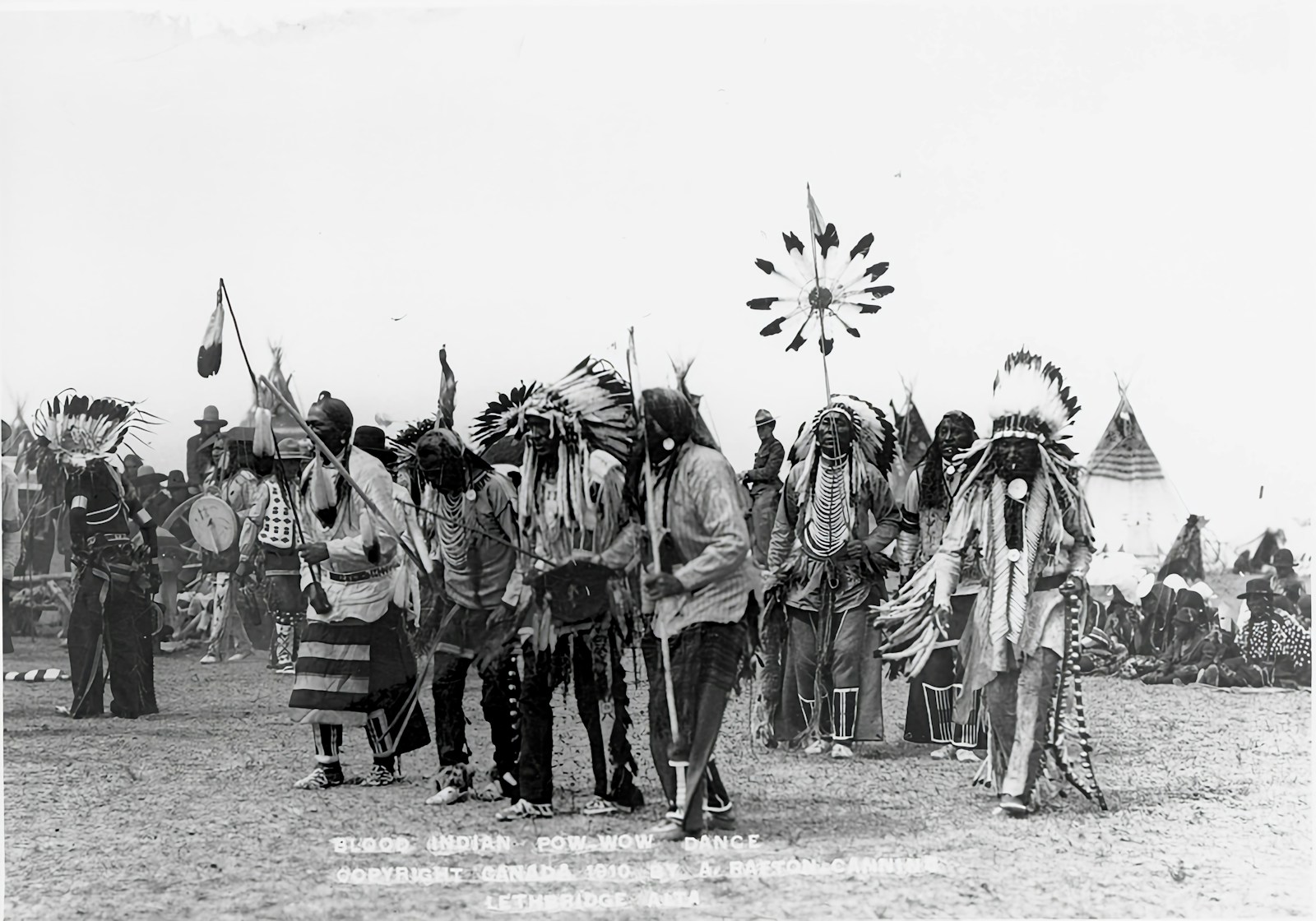 a group of native american men standing next to each other