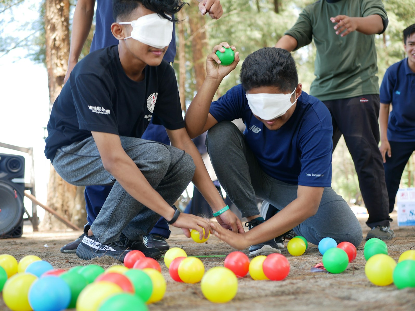 Kids Playing Balloon Pop Quiz in Campground
