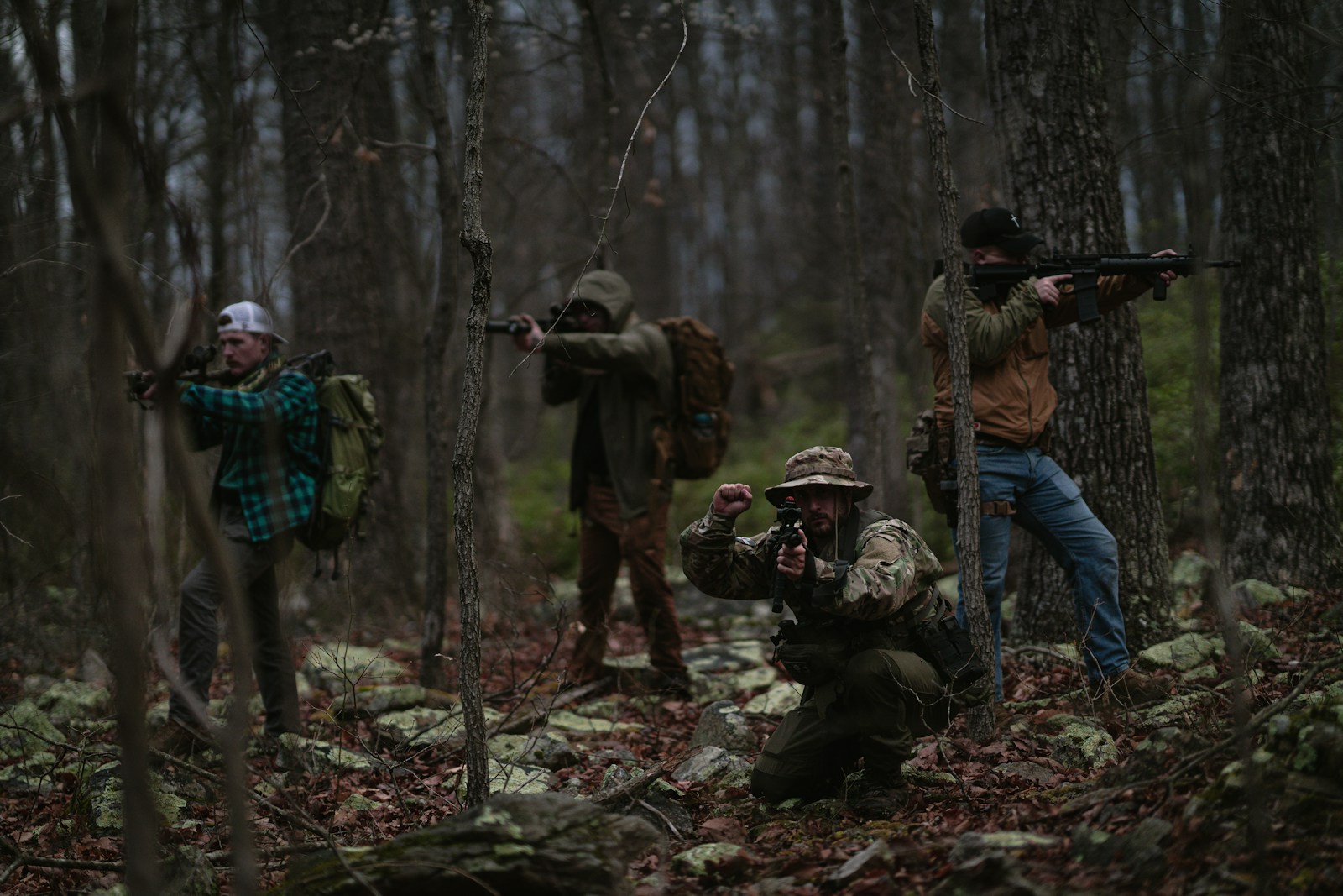 taiki-ishikawa-w6EMxsk8CDA-unsplash A group of men in the woods with guns