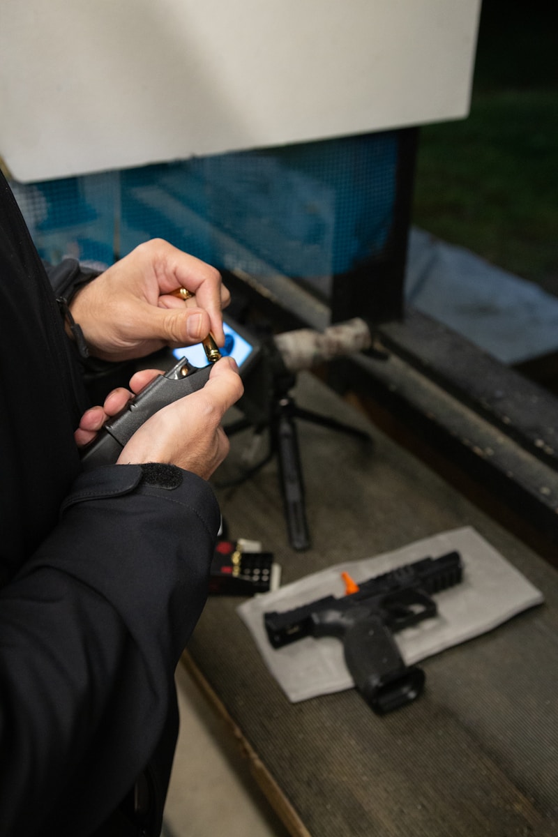 A man in a black jacket holding a cell phone
