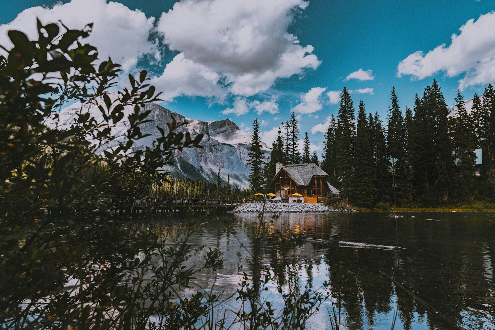 Wooden log cabin on a lake in the Rocky Mountains Canada