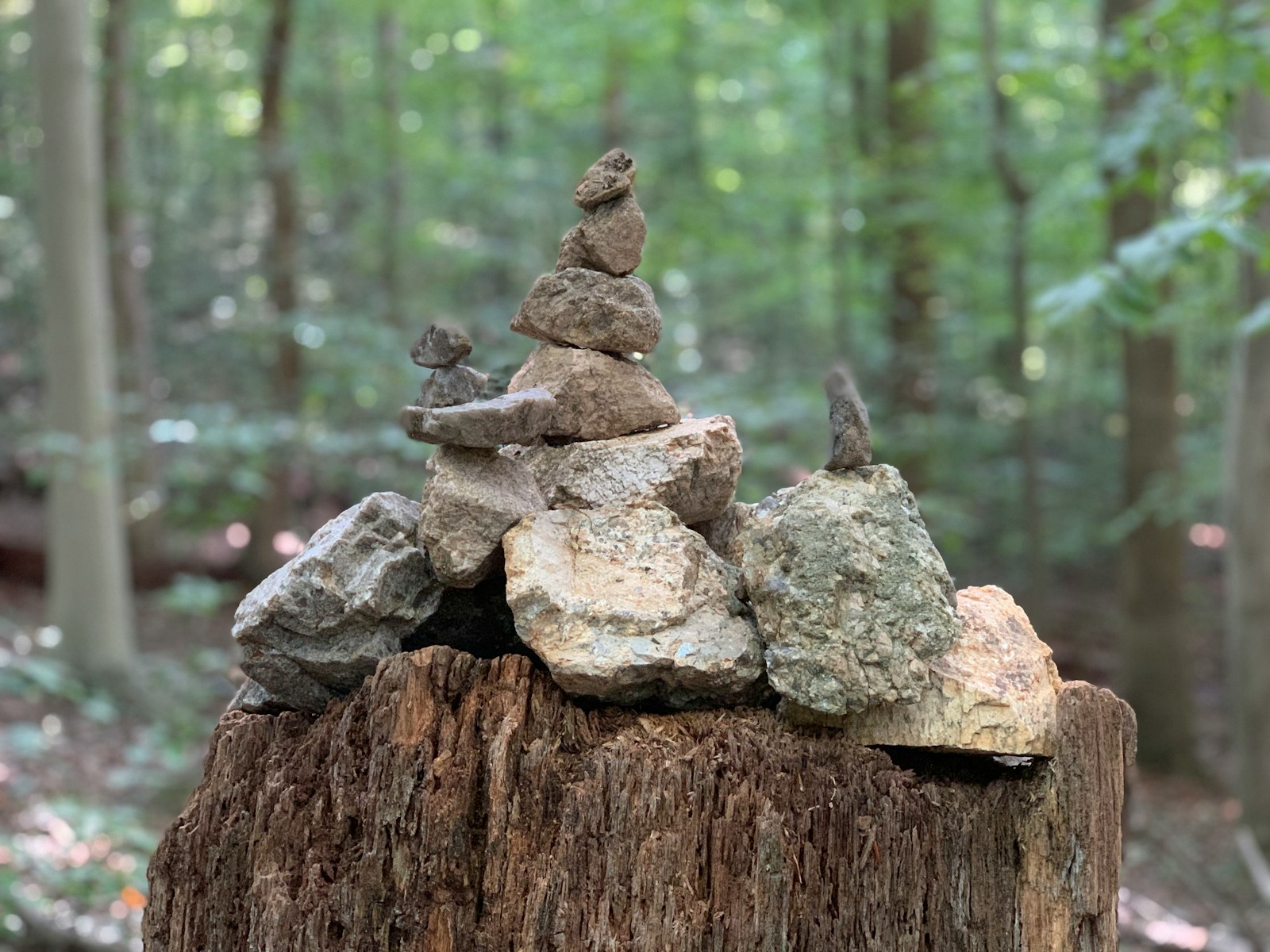 Building Rock Cairns During Camping