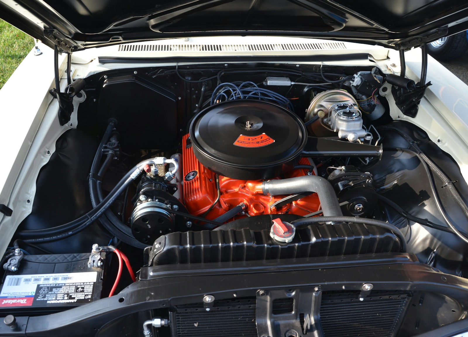 The engine compartment of a car with the hood open