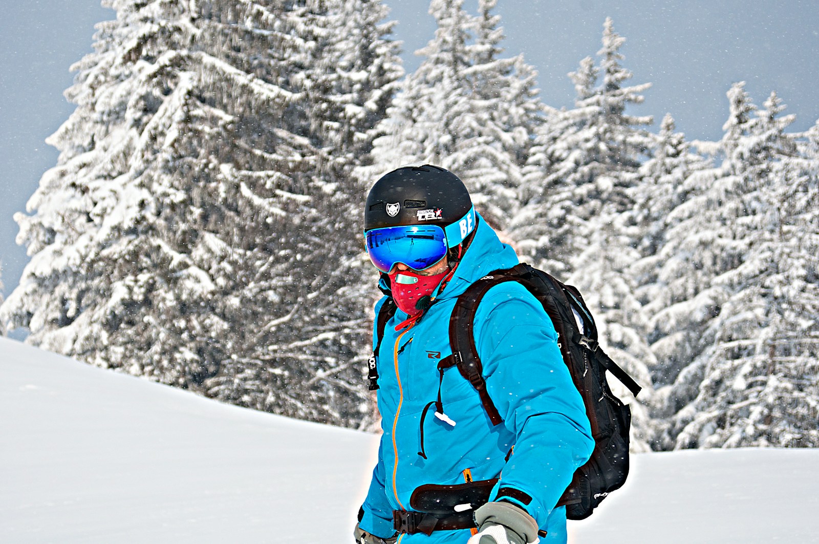A Hiker Wearing Waterproof Parka While Hiking in Snowy Region