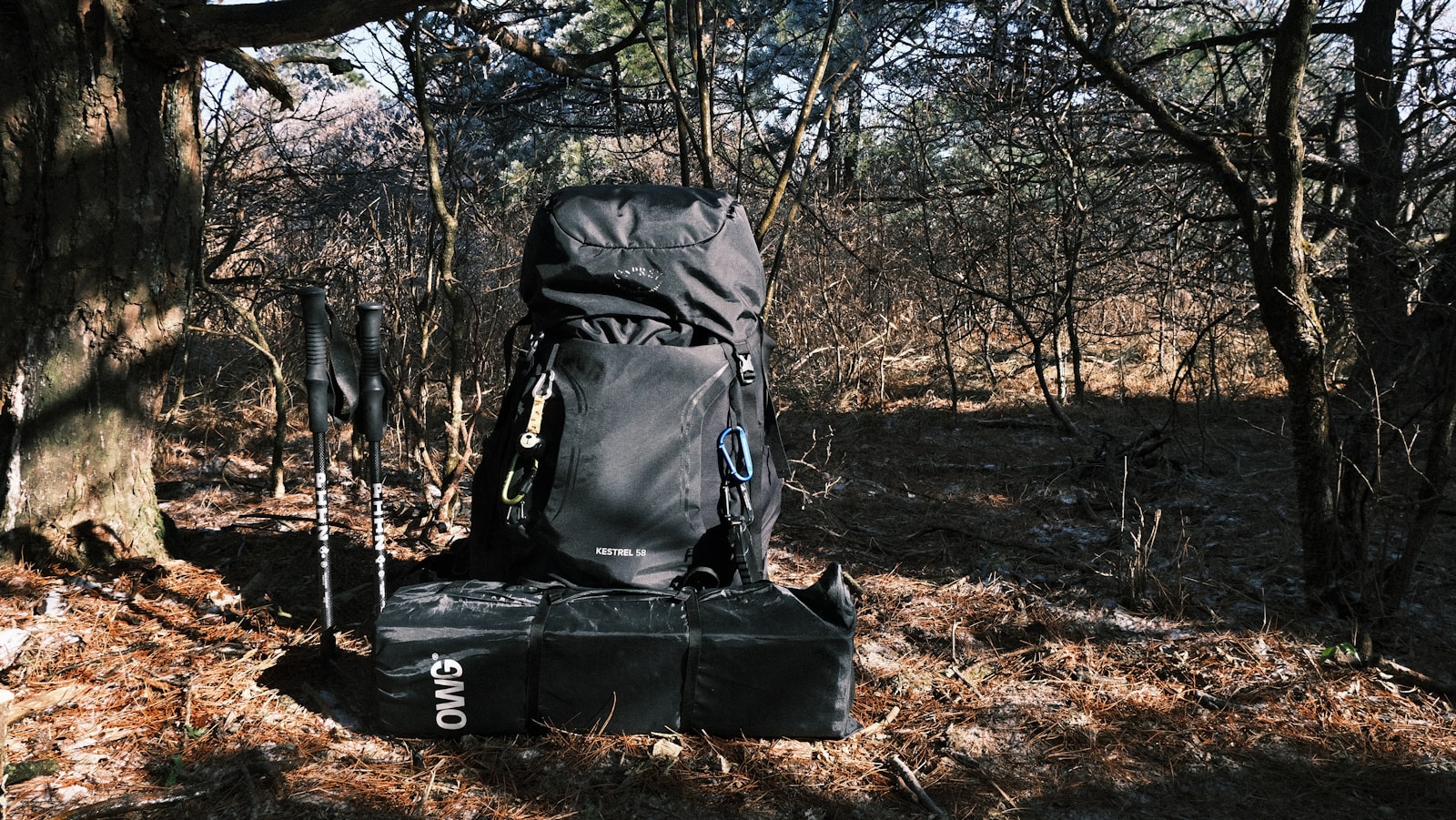 a black backpack sitting on top of a black bag