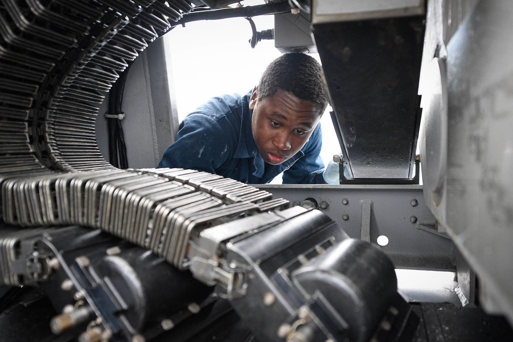 A Person Cleaning his Gun