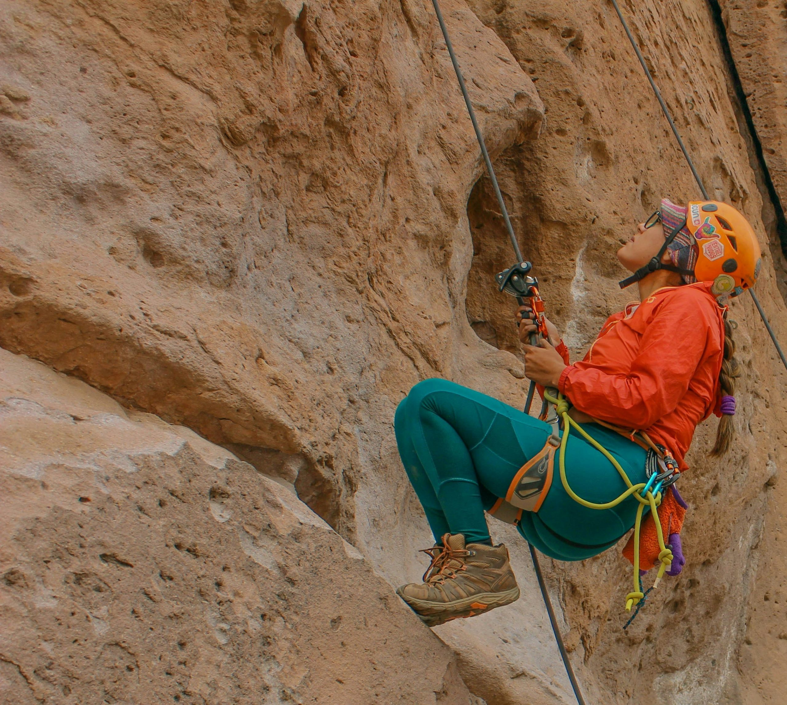 A Person Climbing With Help of a Rope