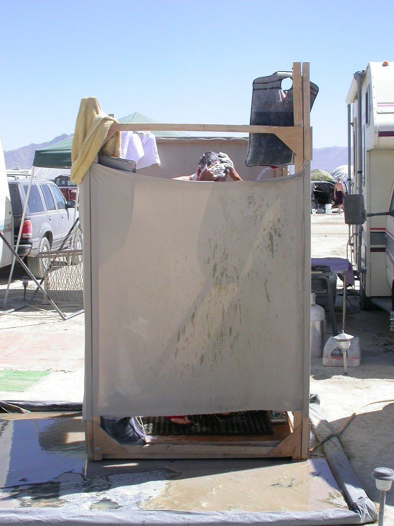 A Person Using Camping Shower Bag