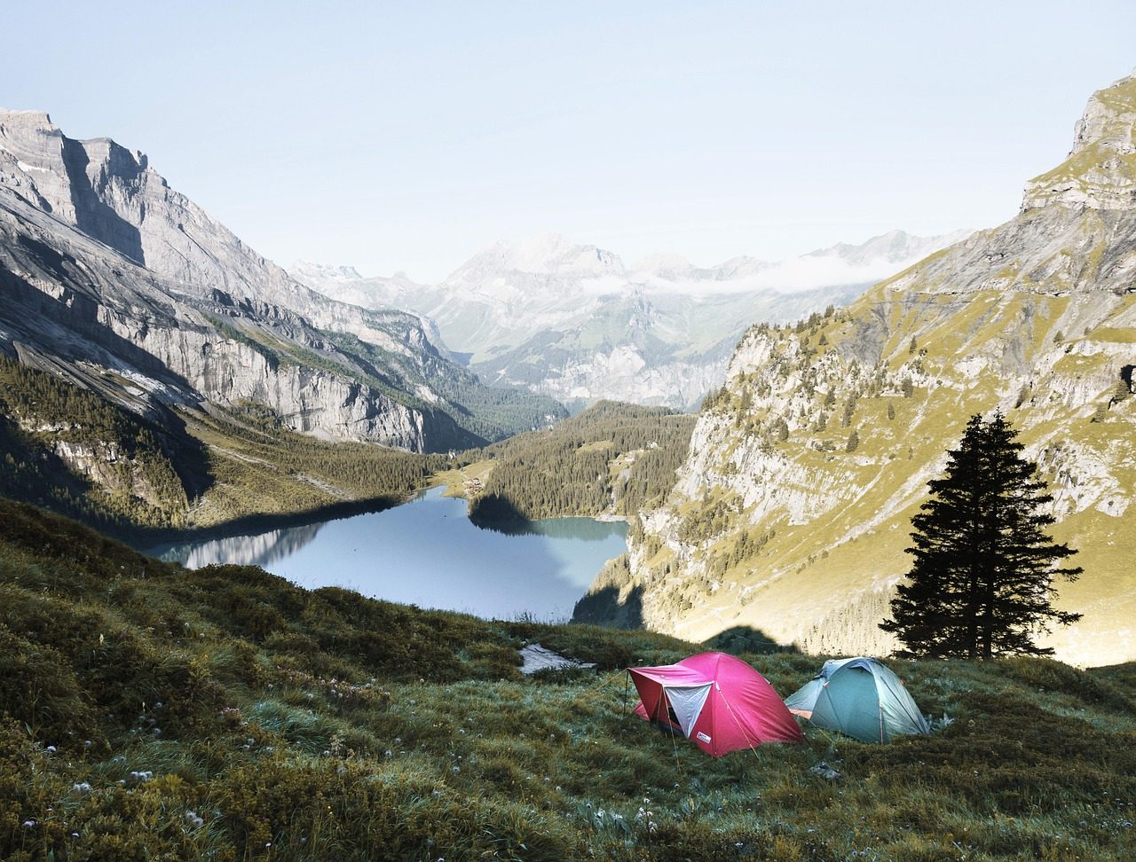 Two Campers Set Tent on Uneven Ground