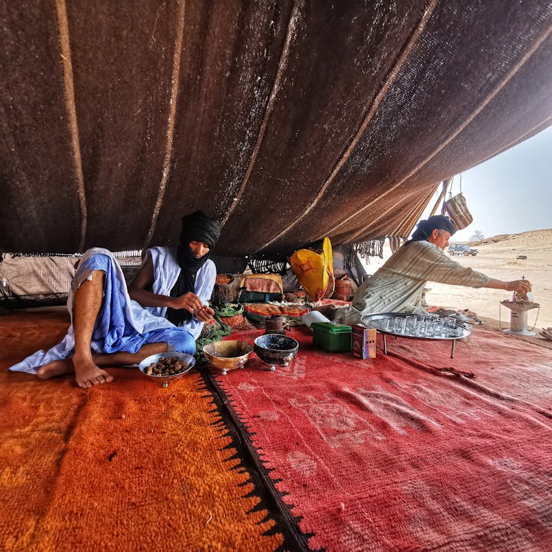 Men in Tent on Desert