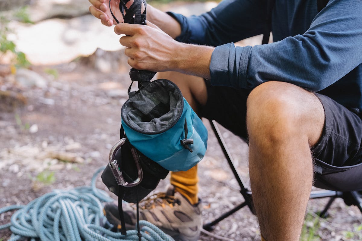 A Person Holding Chalk Bags