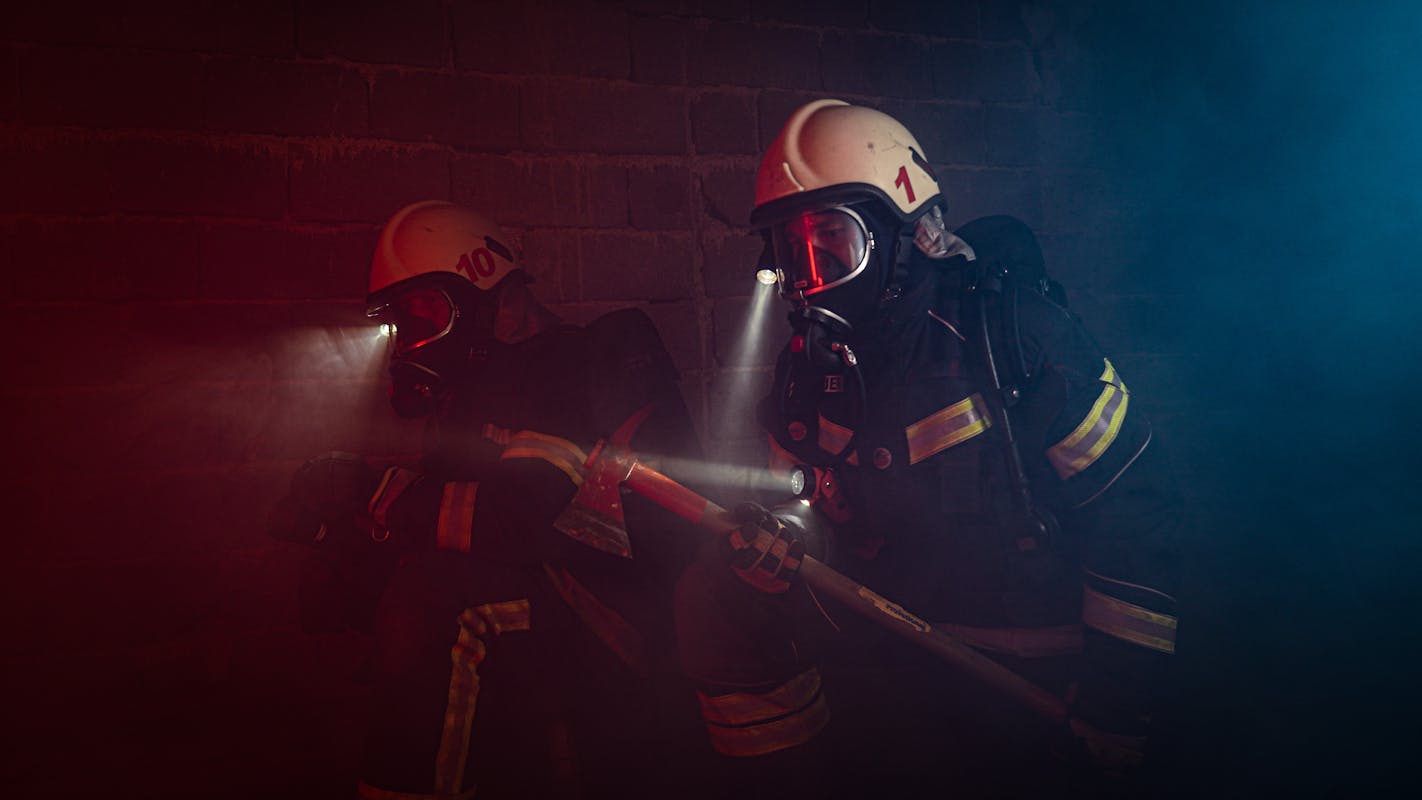 Photograph of a Firefighter Holding an Axe