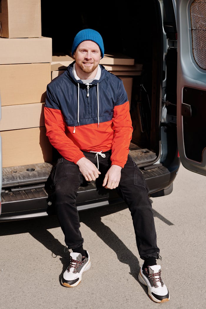 taiki-ishikawa-w6EMxsk8CDA-unsplash Smiled Man Sitting on Car Trunk