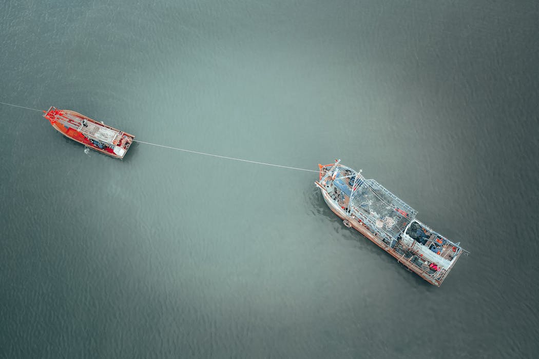 Barge and boat on rippling water