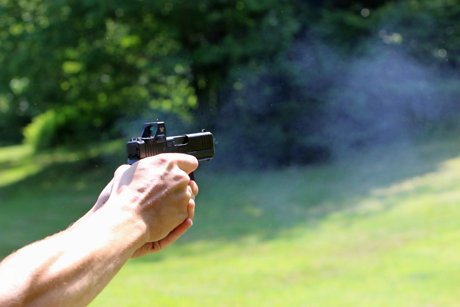 taiki-ishikawa-w6EMxsk8CDA-unsplash A person is shooting a gun