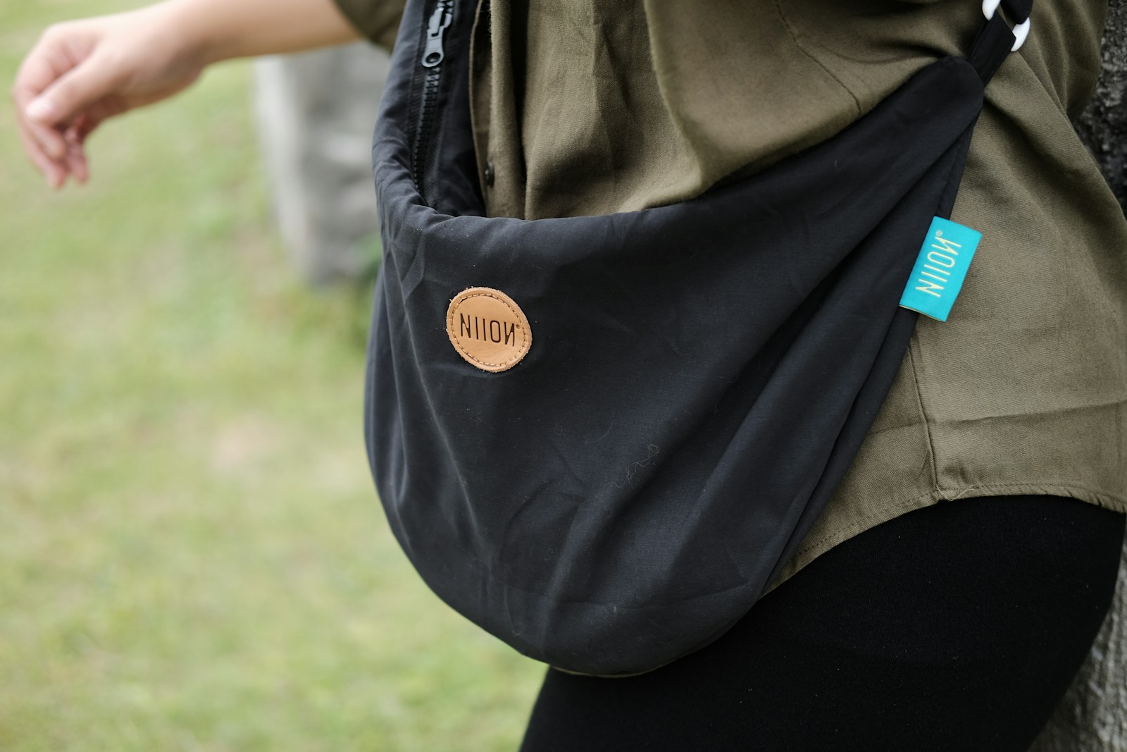 person in black jacket and brown cap