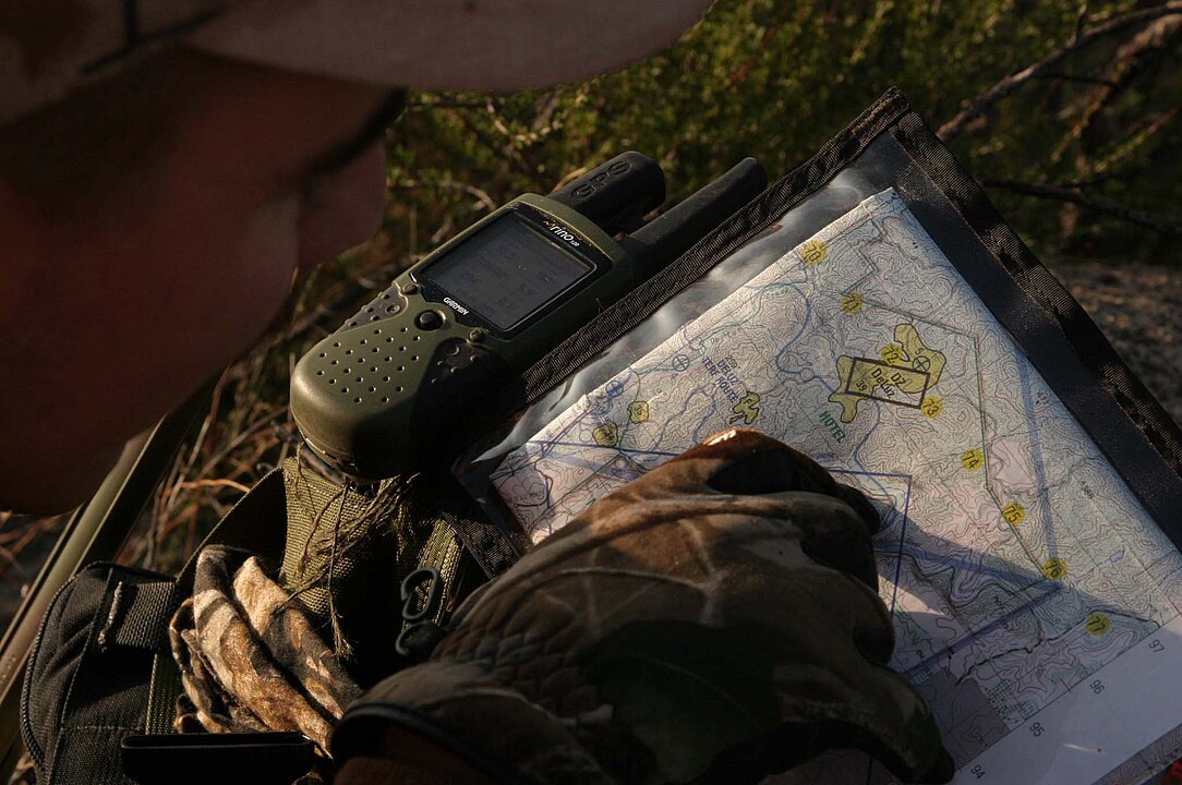 Sergeant Chris D. Washington checking his Topographic map during a morning deer hunt in Kilgore, Texas