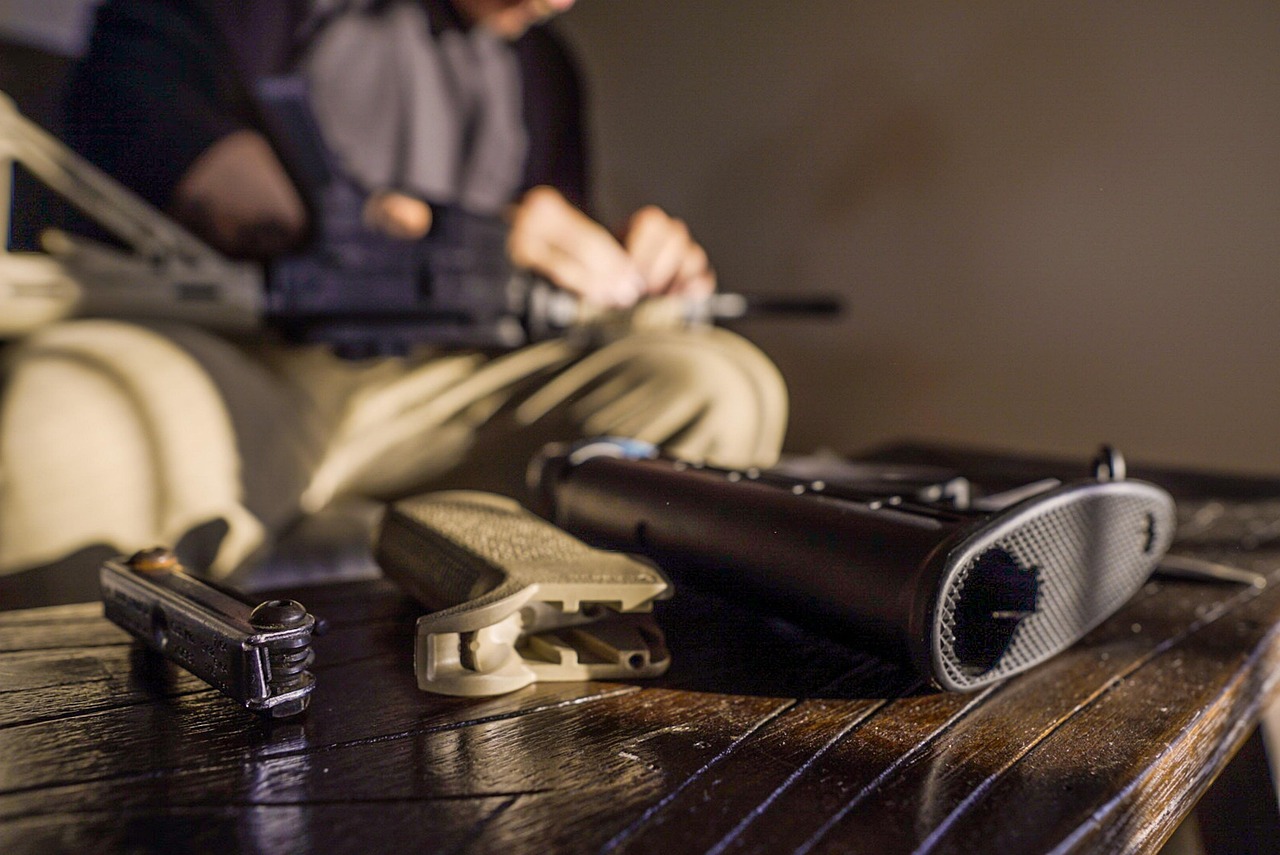 taiki-ishikawa-w6EMxsk8CDA-unsplash A Hunter Inspecting his Gun