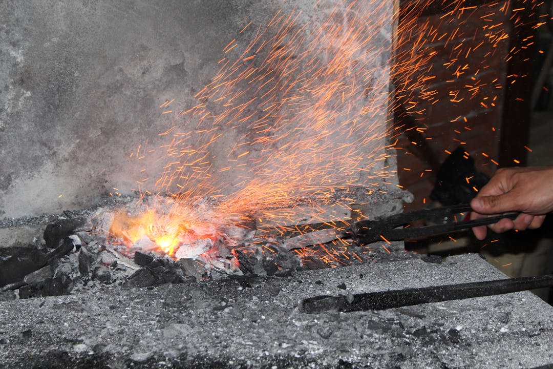 Blacksmith at Work with Sparks Flying