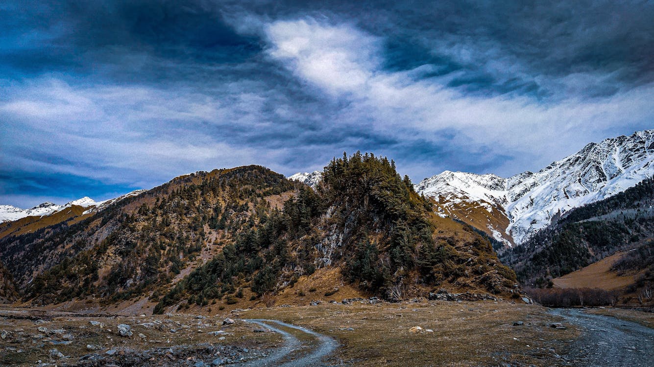 Off Roads Towards the Snow Cover Mountain