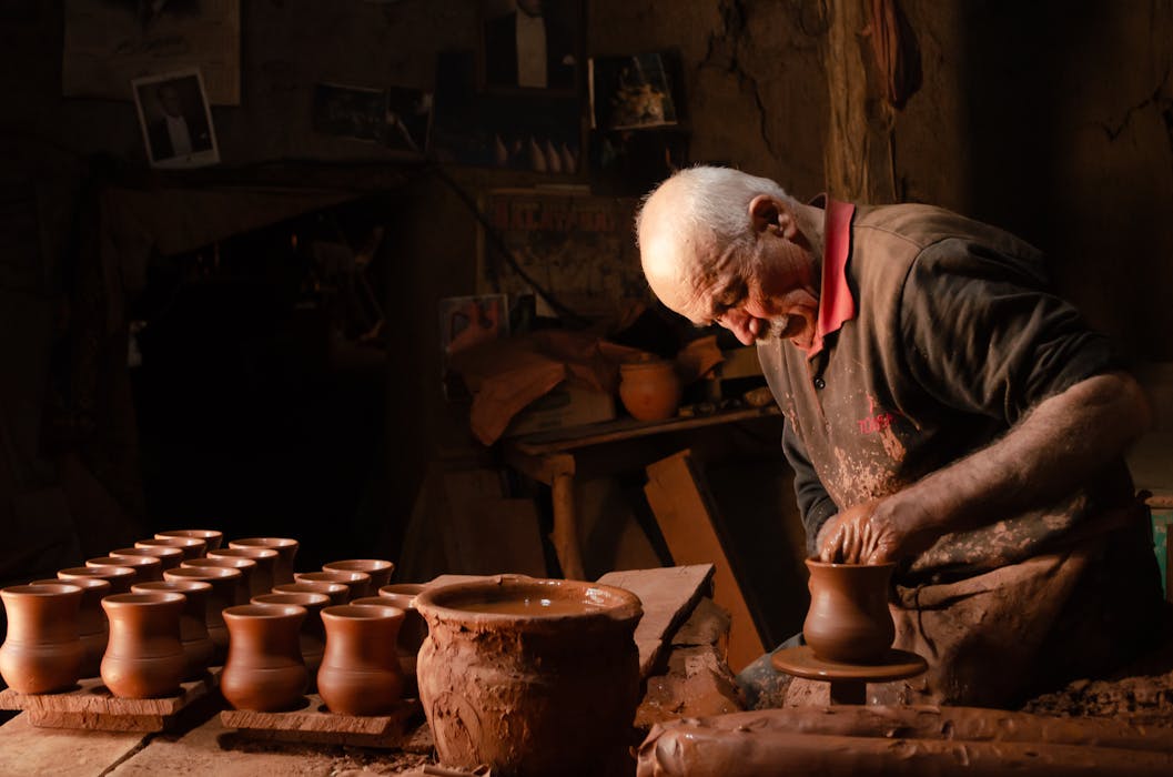 Skilled Artisan Crafting Pottery in Turkish Workshop