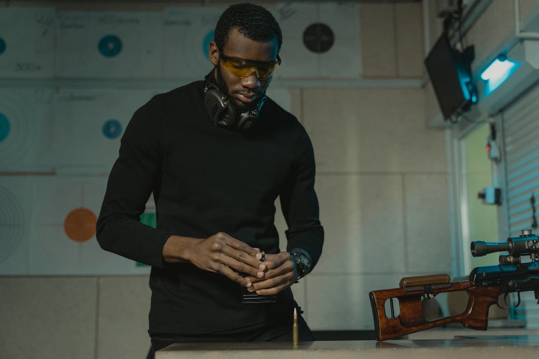 Man in Black Long Sleeve Shirt and Black Pants Wearing Safety Glasses