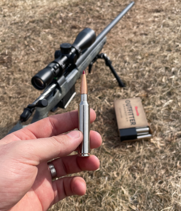 A Person Holding a 300 Precision Rifle Bullet