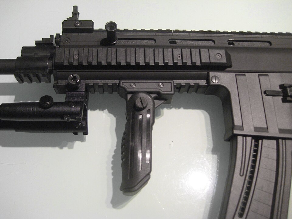 ISSC MK22 rifle with a vertical forward grip