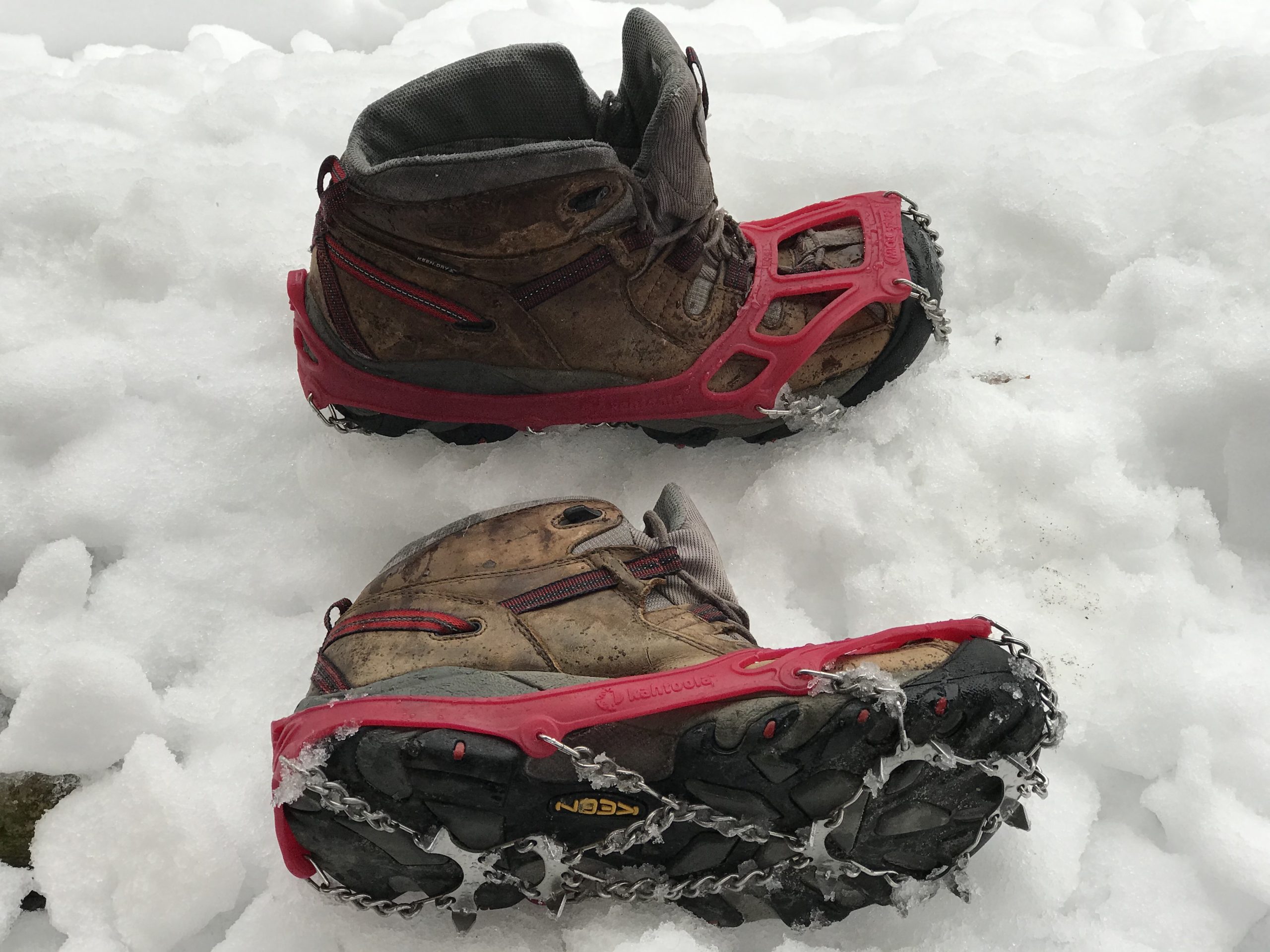 Microspikes shown on hiking boots for traction on snow